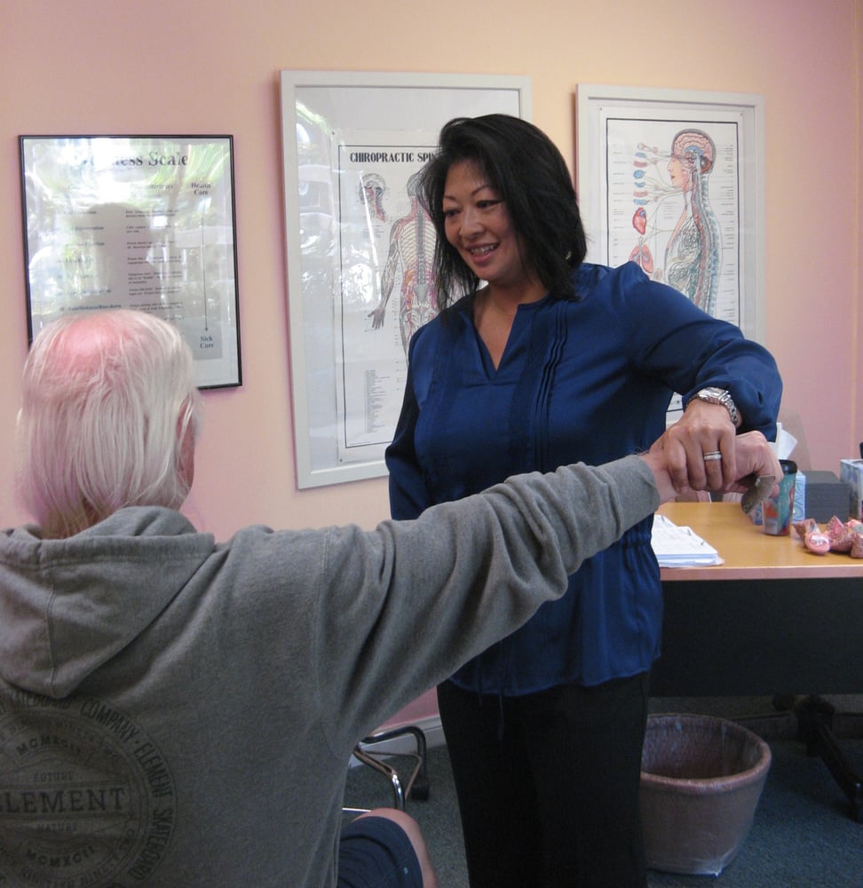 Dr. Karin Kim working with a patient